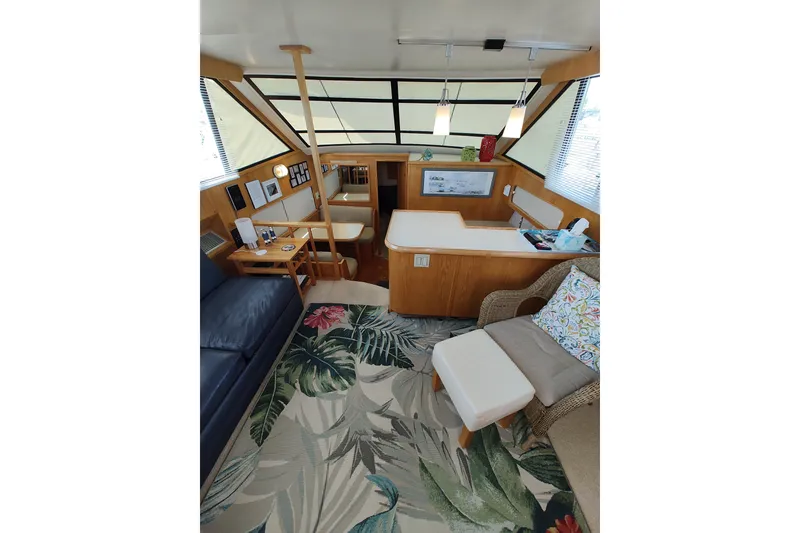 Slide: The Image of Interior of 1989 Chris-Craft 372 Catalina yacht with tropical decor and cozy seating. - 9