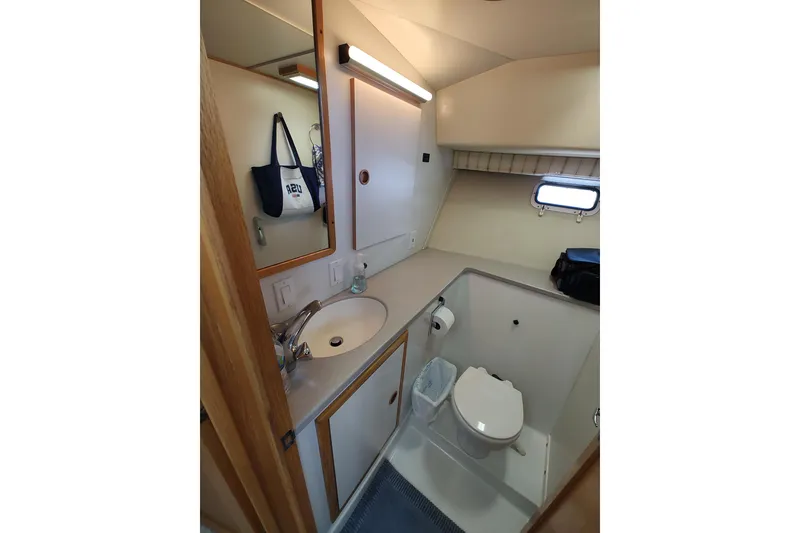 Slide: The Image of Bathroom interior of 1989 Chris-Craft 372 Catalina yacht, featuring sink and toilet. - 13