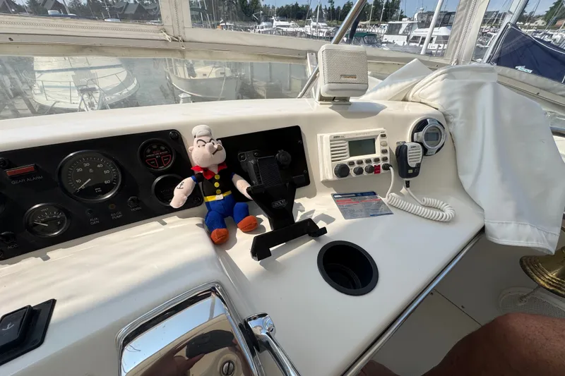 Slide: The Image of Helm of 1989 Chris-Craft 372 Catalina with plush toy and marine electronics. - 36