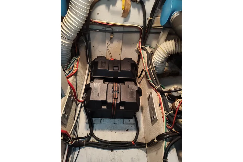 Slide: The Image of Engine room of 1989 Chris-Craft 372 Catalina with dual battery setup and wiring. - 23