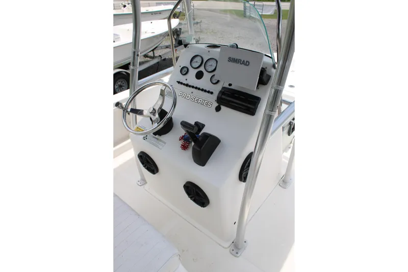 Slide: The Image of 2012 Sea Fox 187 Center Console boat dashboard with steering wheel and controls. - 19
