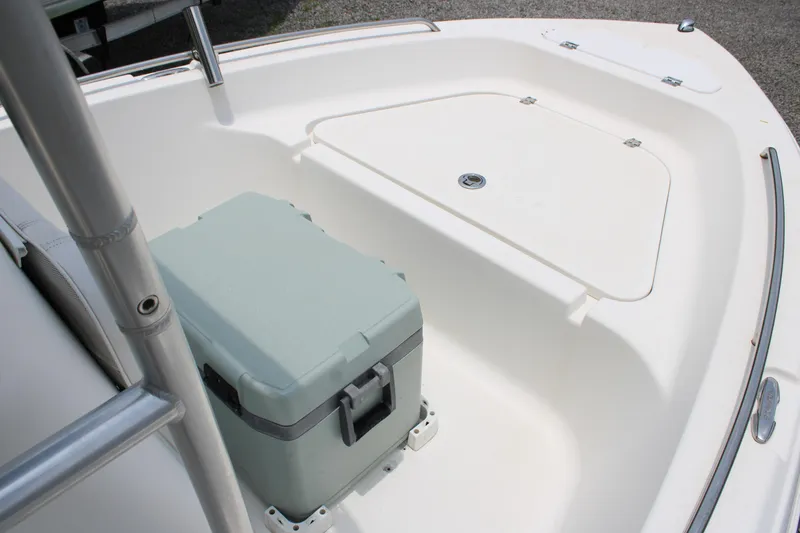 Slide: The Image of 2012 Sea Fox 187 Center Console boat interior with storage compartment and cooler. - 12