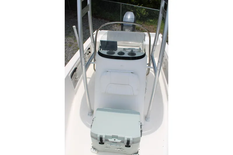 Slide: The Image of 2012 Sea Fox 187 Center Console boat interior with steering console and cooler. - 13
