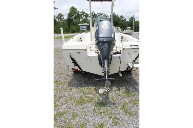 Slide: The Image of 2012 Sea Fox 187 Center Console boat with outboard motor, parked on gravel. - 10