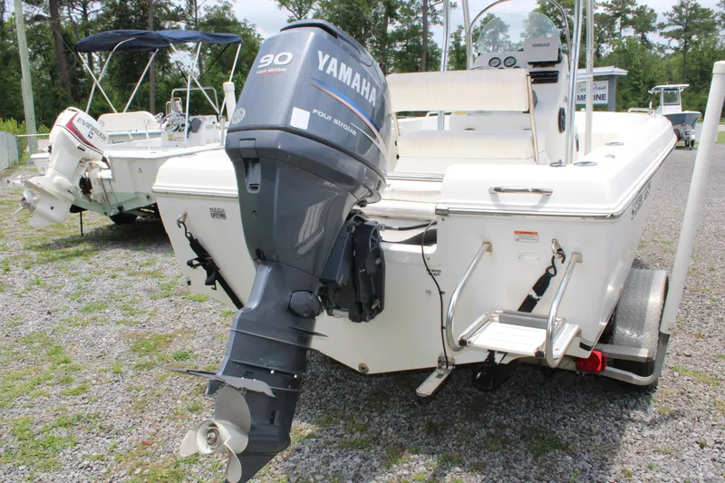 Slide: The Image of 2012 Sea Fox 187 Center Console boat with Yamaha 90 engine, parked on gravel. - 3