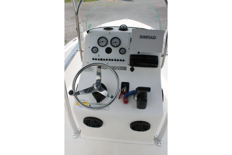 Slide: The Image of 2012 Sea Fox 187 Center Console dashboard with steering wheel and gauges. - 18