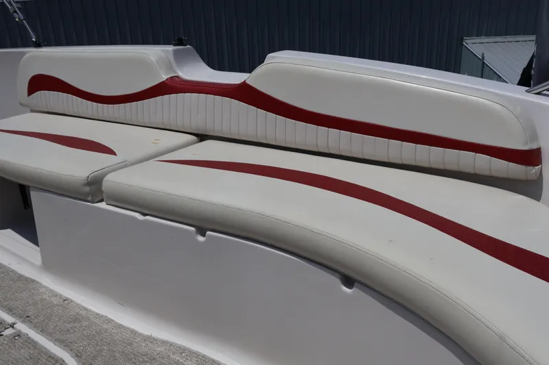 Slide: The Image of 2008 Starcraft 2000 IO Limited boat seating with red and white upholstery design. - 44