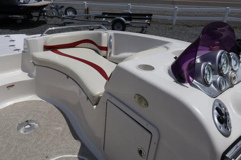 Slide: The Image of 2008 Starcraft 2000 IO Limited boat interior with seating and dashboard controls. - 42