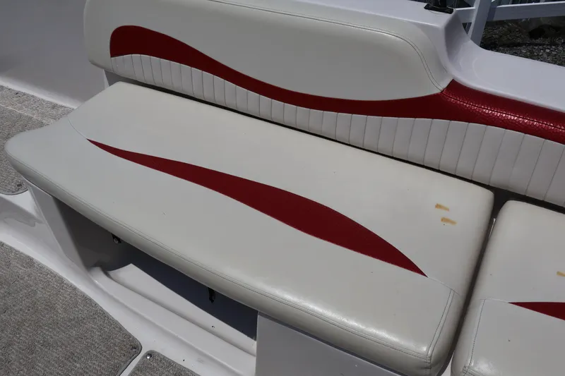 Slide: The Image of White and red seating on a 2008 Starcraft 2000 IO Limited boat. - 33