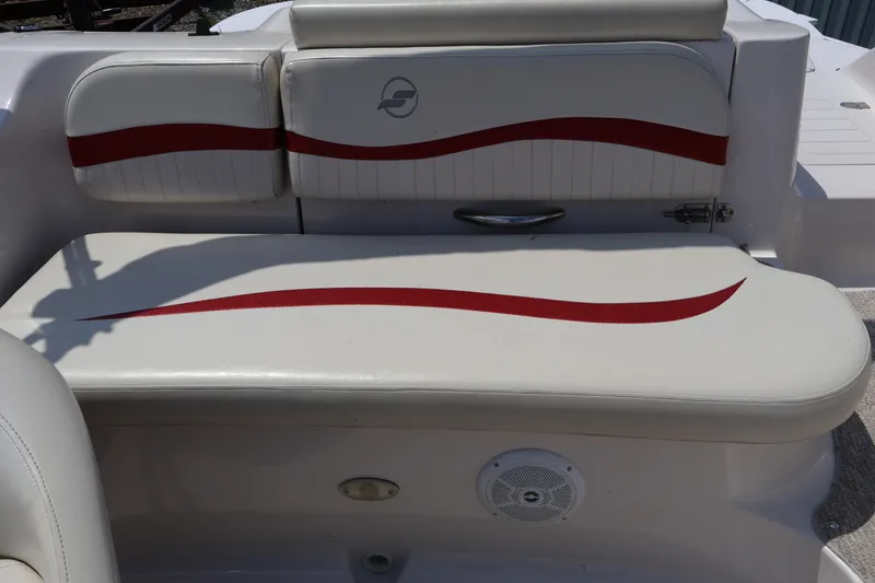 Slide: The Image of 2008 Starcraft 2000 IO Limited boat seating with red accents and logo. - 22