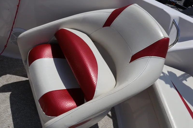Slide: The Image of Red and white boat seat in a 2008 Starcraft 2000 IO Limited. - 28