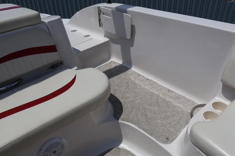 Slide: The Image of Interior of 2008 Starcraft 2000 IO Limited boat with cushioned seating and carpeted floor. - 15