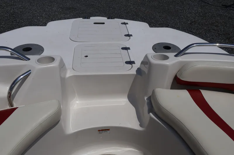 Slide: The Image of 2008 Starcraft 2000 IO Limited boat interior with white and red seating. - 46