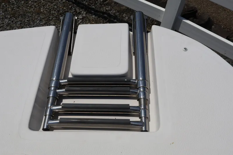 Slide: The Image of Foldable ladder on a 2008 Starcraft 2000 IO Limited boat deck. - 18