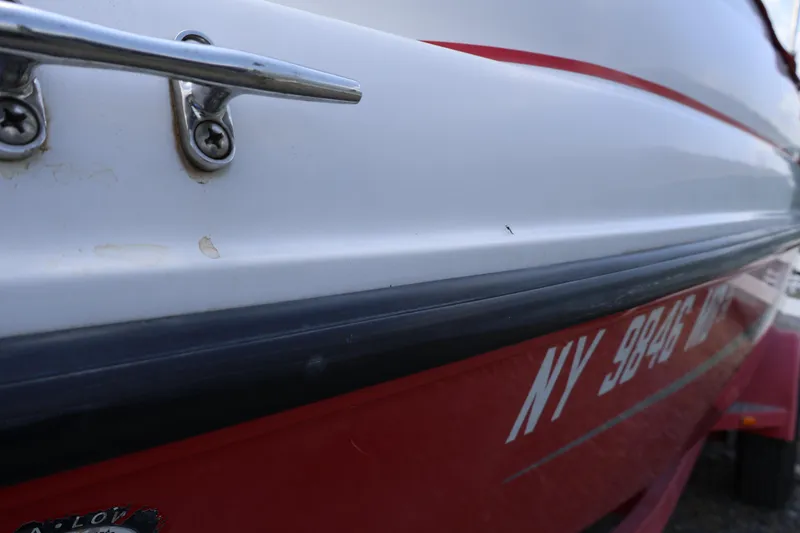 Slide: The Image of Close-up of a 2008 Starcraft 2000 IO Limited boat with visible registration number. - 5