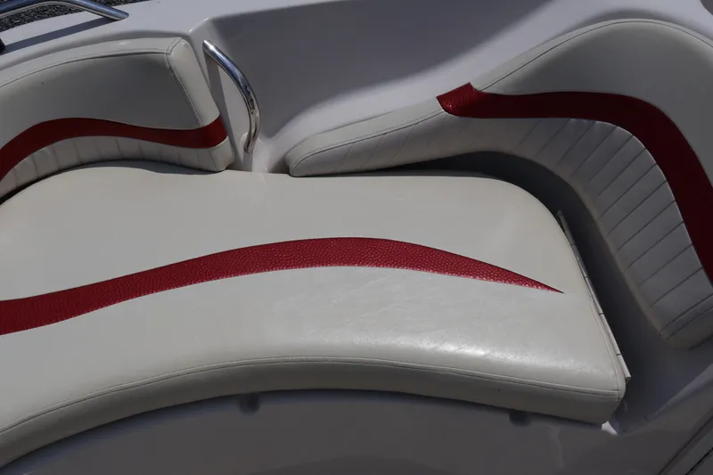 Slide: The Image of 2008 Starcraft 2000 IO Limited boat interior with white and red cushioned seating. - 43