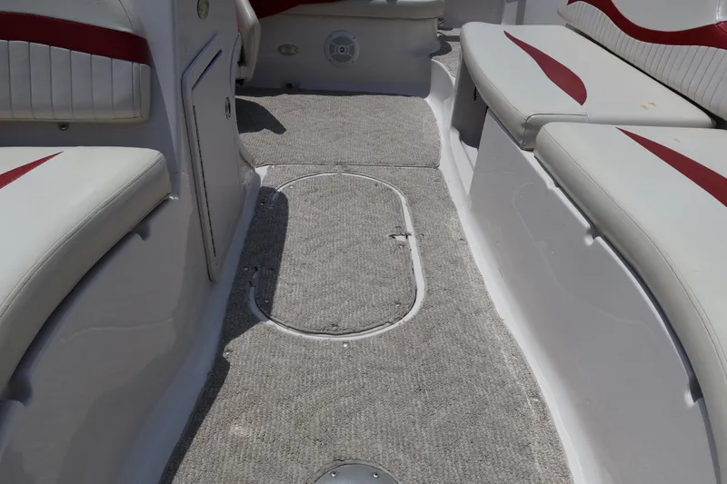 Slide: The Image of Interior of 2008 Starcraft 2000 IO Limited boat with cushioned seating and carpeted floor. - 47