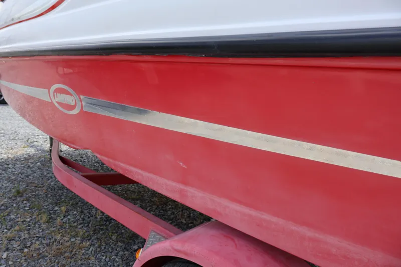 Slide: The Image of Red 2008 Starcraft 2000 IO Limited boat on trailer, side view. - 3