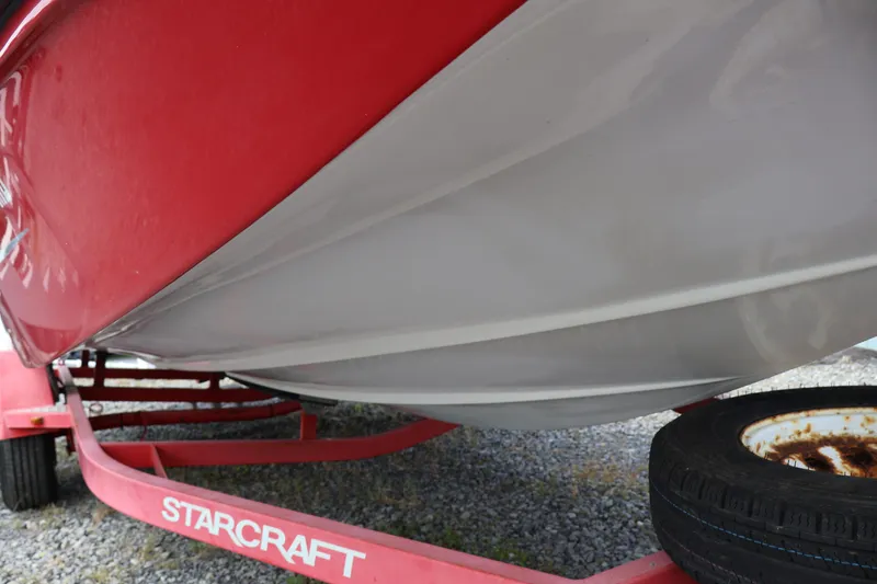 Slide: The Image of Red Starcraft 2000 IO Limited boat on trailer, 2008 model, underside view. - 8