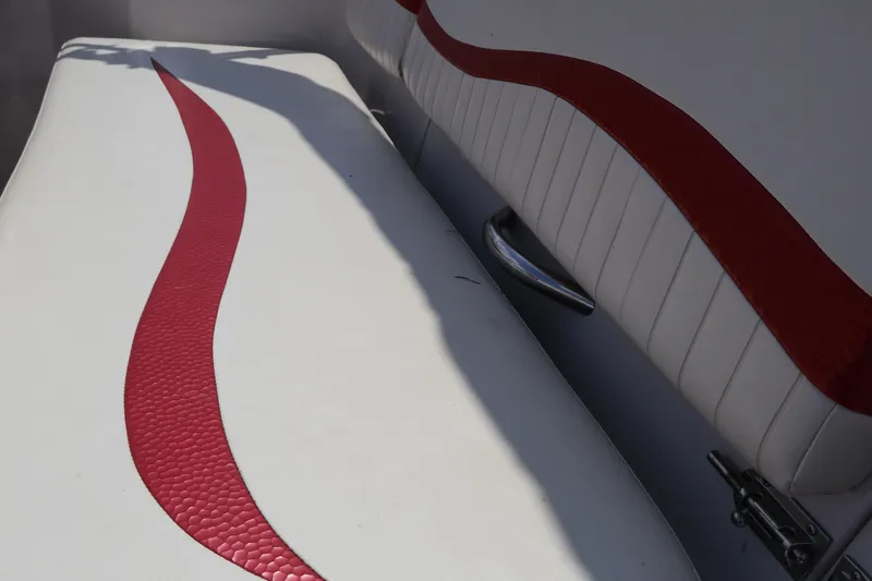 Slide: The Image of 2008 Starcraft 2000 IO Limited boat seats with red accents and sleek design. - 23