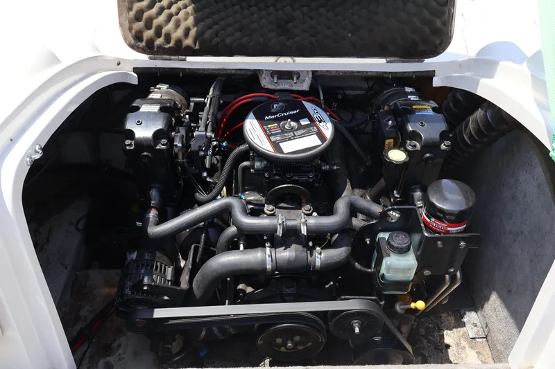 Slide: The Image of Engine compartment of a 2008 Starcraft 2000 IO Limited boat, featuring a MerCruiser engine. - 21