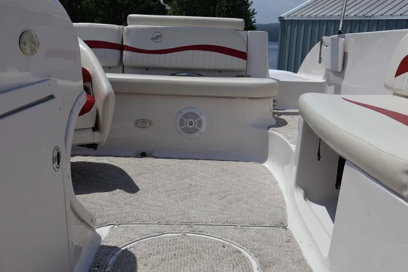 Slide: The Image of 2008 Starcraft 2000 IO Limited boat interior with white and red seating. - 26
