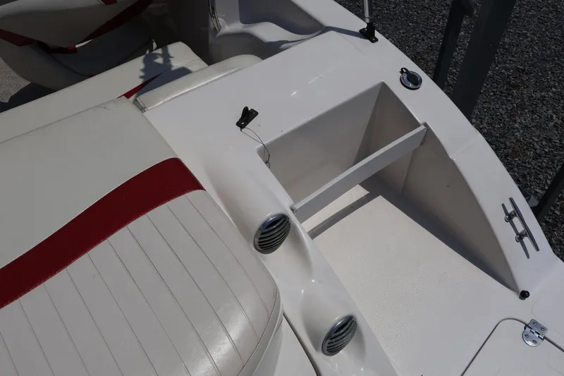 Slide: The Image of 2008 Starcraft 2000 IO Limited boat interior with white and red seating. - 19