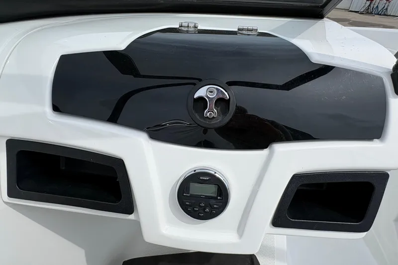 Slide: The Image of Dashboard of a 2018 Tahoe 500 TF boat with stereo system and storage compartments. - 12