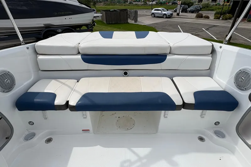 Slide: The Image of Interior seating of a 2018 Tahoe 500 TF boat with blue and white cushions. - 5