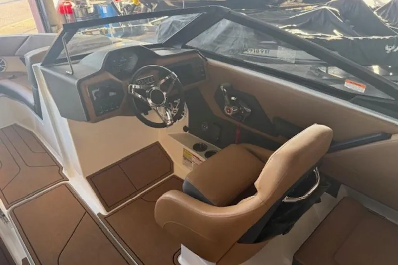 Slide: The Image of Interior of a 2026 Cobalt CS22 boat, featuring a sleek dashboard and comfortable seating. - 9