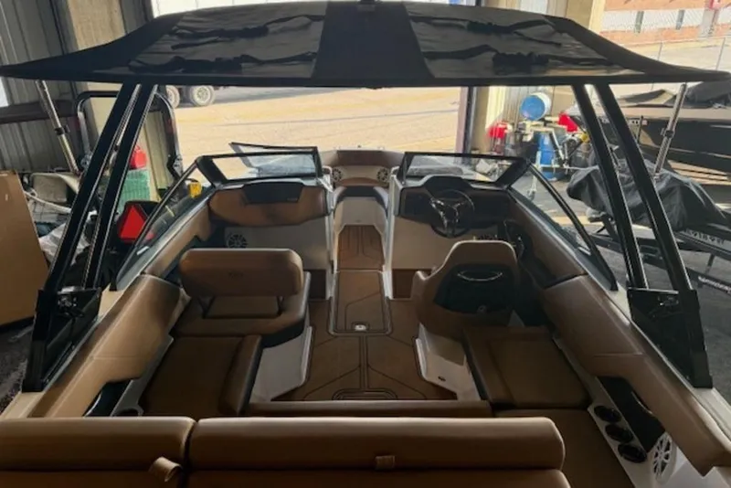 Slide: The Image of Interior view of a 2026 Cobalt CS22 boat with tan seating and modern design. - 13
