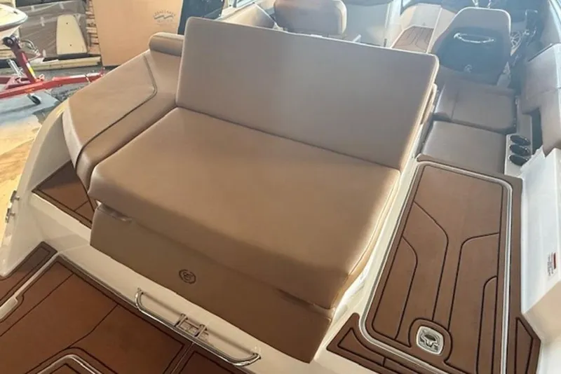 Slide: The Image of 2026 Cobalt CS22 boat interior with tan seating and brown flooring. - 14