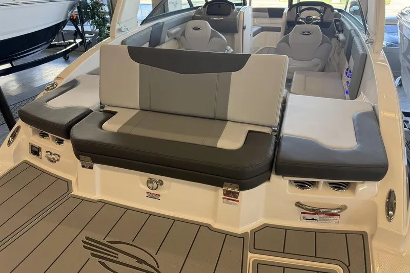 Slide: The Image of 2026 Chaparral 23 SSi boat interior with gray seating and modern design. - 10