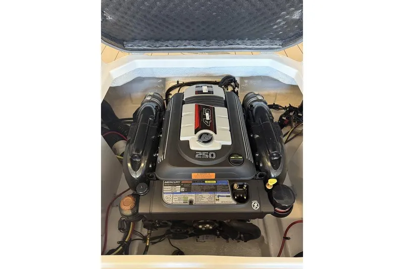 Slide: The Image of Engine compartment of 2026 Chaparral 23 SSi boat, featuring a powerful 4.5L engine. - 4