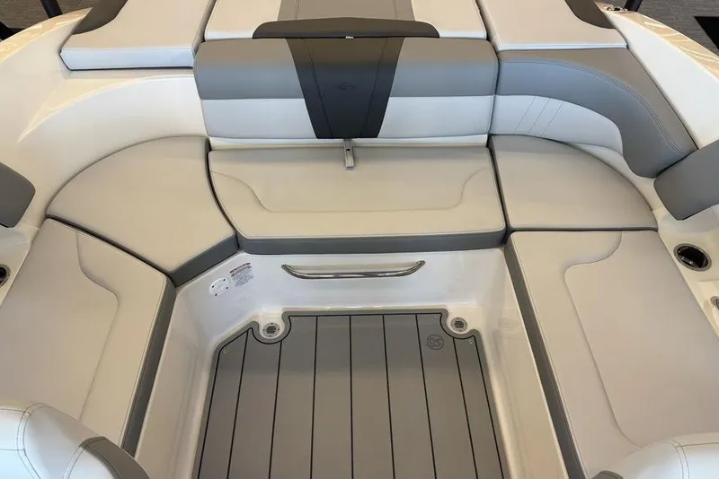 Slide: The Image of 2026 Chaparral 23 SSi boat interior with gray and white cushioned seating. - 8