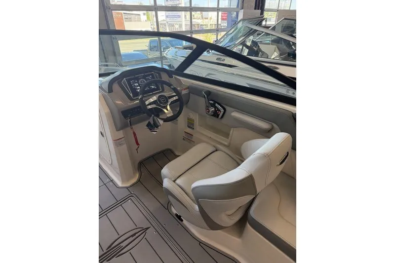 Slide: The Image of 2026 Chaparral 23 SSi boat interior with modern dashboard and steering wheel. - 7