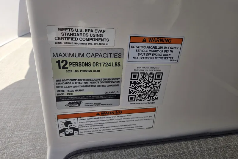 Slide: The Image of Warning labels on a 2020 Regal 2300 Bowrider boat, detailing safety and capacity information. - 5