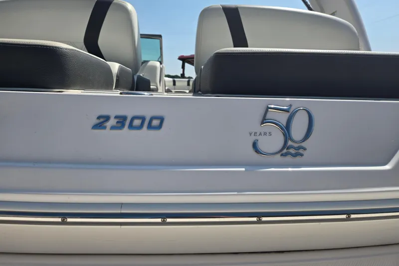 Slide: The Image of 2020 Regal 2300 Bowrider boat, celebrating 50 years, with sleek seating design. - 21