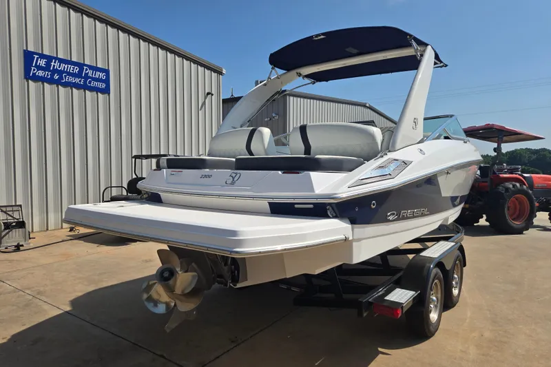 Slide: The Image of 2020 Regal 2300 Bowrider boat on trailer at service center. - 23