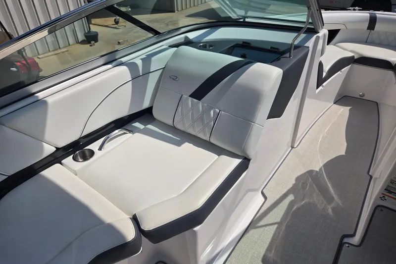 Slide: The Image of 2020 Regal 2300 Bowrider interior with white seating and cup holder. - 15