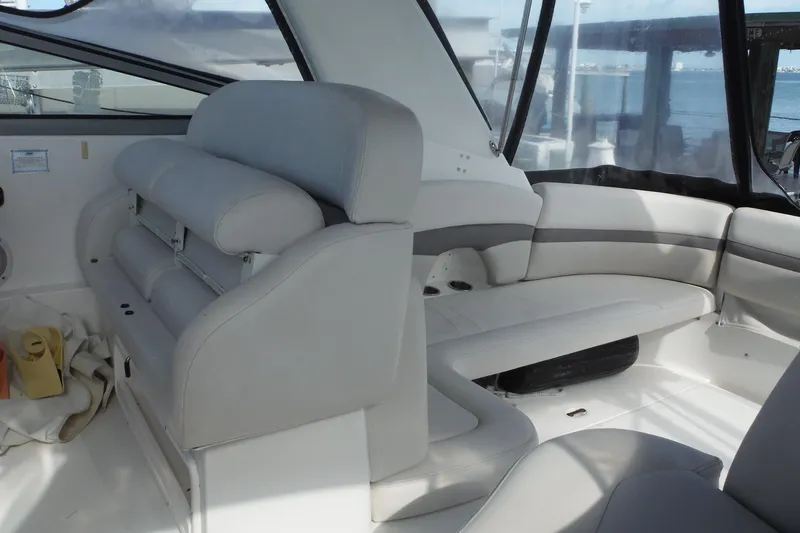 Slide: The Image of 2005 Chaparral Signature 350 boat interior with white seating and panoramic windows. - 29