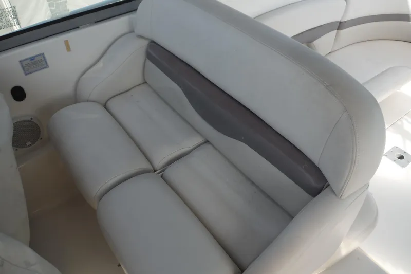 Slide: The Image of 2005 Chaparral Signature 350 boat interior with white cushioned seating. - 41