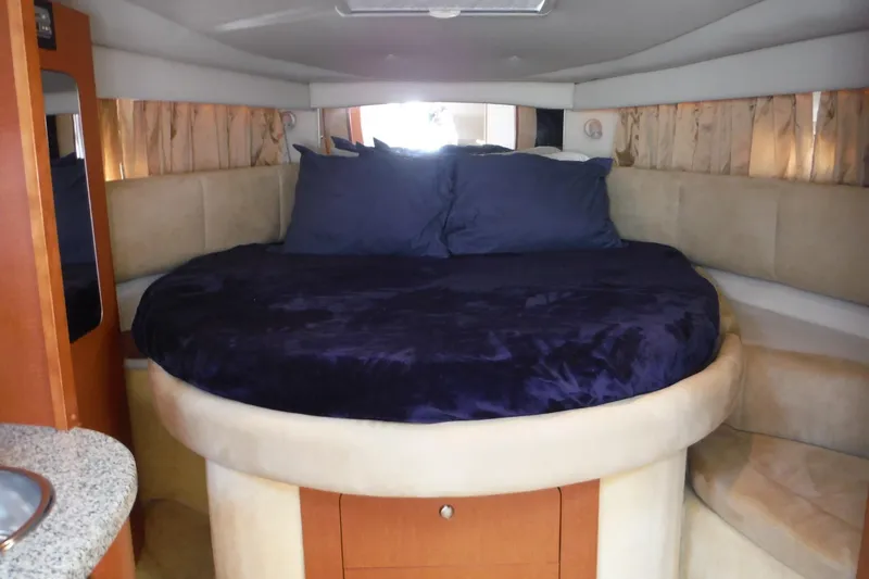 Slide: The Image of Luxurious interior cabin of 2005 Chaparral Signature 350 yacht with plush bedding. - 17