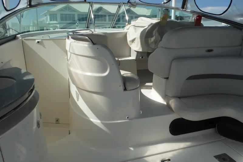 Slide: The Image of Interior of a 2005 Chaparral Signature 350 boat with white seating and helm. - 42