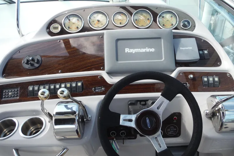 Slide: The Image of Helm of 2005 Chaparral Signature 350 with Raymarine navigation system and classic gauges. - 40