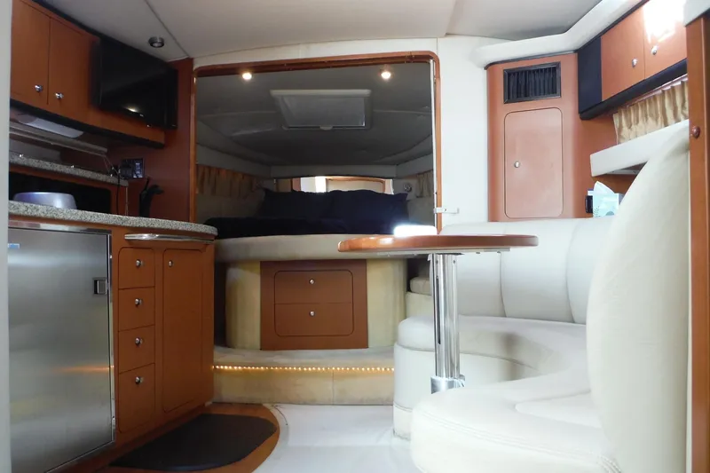 Slide: The Image of Luxurious interior of 2005 Chaparral Signature 350 yacht with modern amenities and cozy seating. - 21