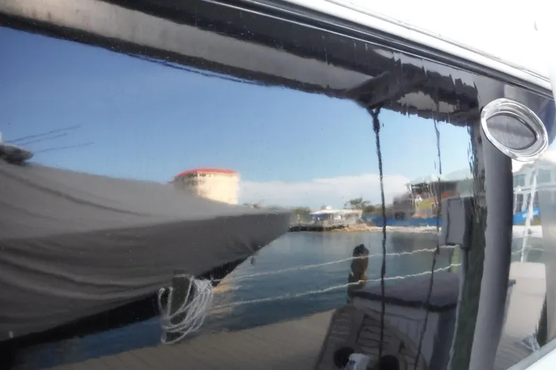 Slide: The Image of Reflection on Chaparral Signature 350 boat window, marina view, 2005 model. - 47