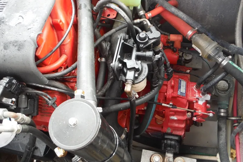 Slide: The Image of Engine compartment of a 2005 Chaparral Signature 350 boat, showcasing intricate mechanical components. - 35