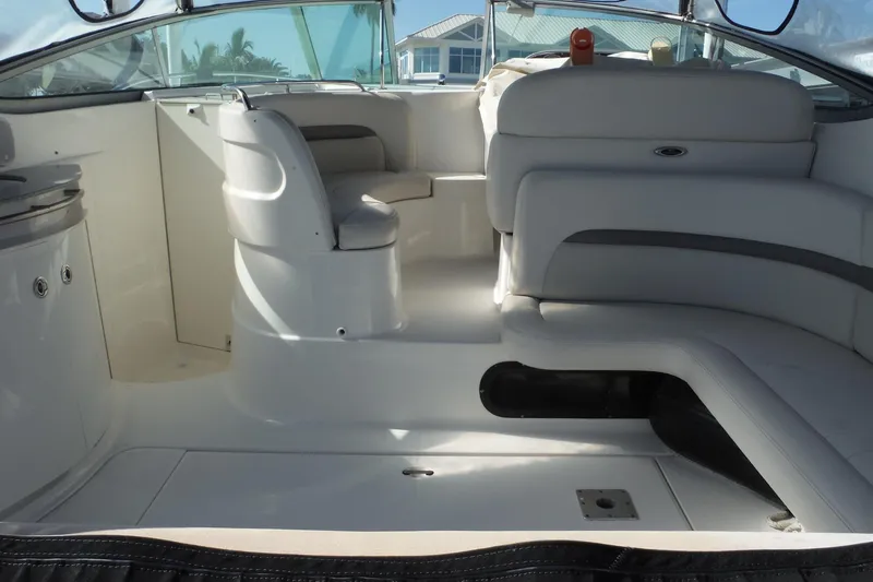 Slide: The Image of 2005 Chaparral Signature 350 boat interior with white seating and helm station. - 6