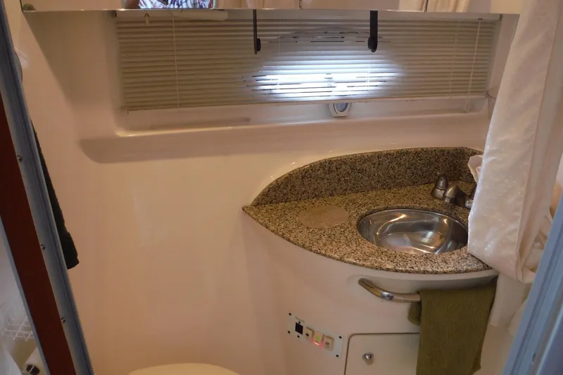 Slide: The Image of 2005 Chaparral Signature 350 bathroom with granite countertop and stainless steel sink. - 23